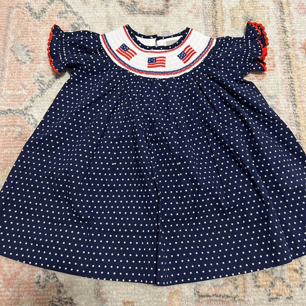 12-18 months. Smocked dress. Navy with stars American flag embroidery. NWOT
